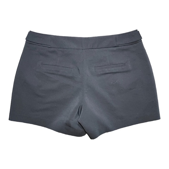 ELLE, BLACK POLISHED SHORTS WITH SILVER BUTTON DETAIL AT WAIST. SIZE 8 - Picture 2 of 6